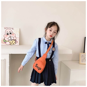 Girl wearing a vibrant orange canvas crossbody bag with black letter print and strap