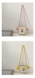 Detail of handmade straw shoulder bag with floral embroidery and tassel rope strap