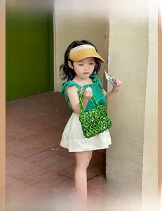 Detailed view of kids woven bead handbag in vibrant green for summer fashion