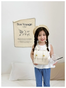 Cute vintage beige PU leather children's backpack shown on a young Asian girl model