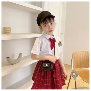 Detailed school-style summer outfit featuring a white shirt and red plaid pleated skirt