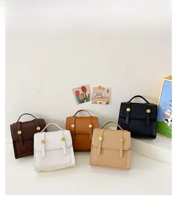 Still life display of retro PU leather mini backpacks in five assorted colors with gold snaps