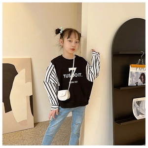 Detailed view of kids sports sweatshirt with number 7 print and striped sleeves