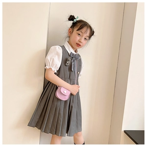 Detail of pink PU mini shoulder bag accessory paired with cute school uniform for girls
