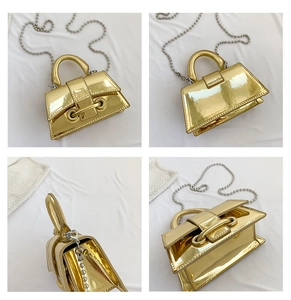 Detailed four-way view of a glossy gold mini handbag with a silver ball chain strap