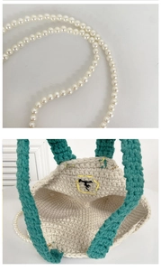 Detailed close-up of handmade crochet bag with pearl strap and contrast green handles