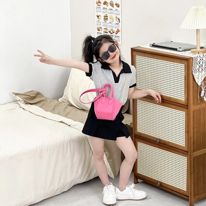 Mini rose pink PU leather crossbody bag for girls styled with a fashion polo outfit