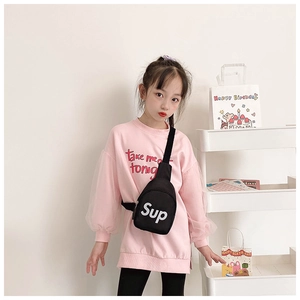 Detail showing kids black nylon crossbody bag with bold white Sup letter print
