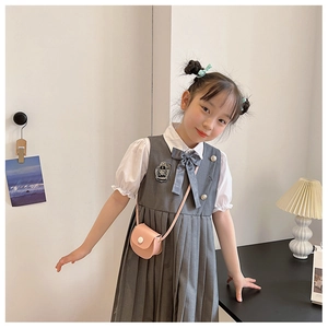 Detail of girls' preppy dress set with bubble sleeve shirt and pleated skirt with crossbody bag