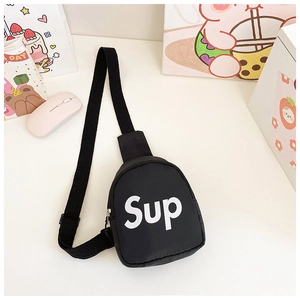 Detail of kids canvas chest bag with adjustable strap and white bold lettering