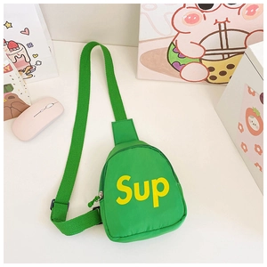 Detail view of the green canvas crossbody bag featuring a yellow printed Sup letter design