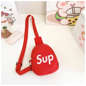 Detail of red canvas kids chest bag featuring white Sup letter print and adjustable strap