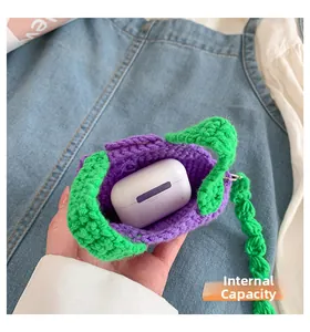 Detail view of purple and green hand-knitted mini pouch storage for wireless headphones