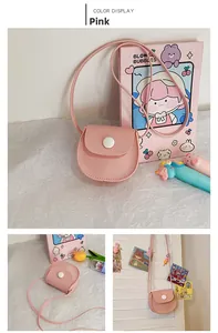 Detailed view of pink mini PU leather saddle bag for girls with round buckle and strap