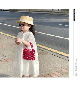 Detail of red beaded handmade woven handbag for girls with summer fashion style