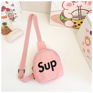 Close-up of pink canvas chest bag featuring Sup letter print and adjustable strap