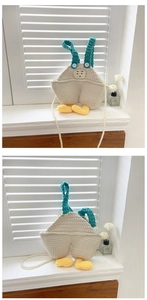 Detail of handmade crochet overall bag with pearl chain and duck feet decoration