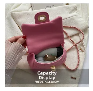 Detailed interior of pink quilted mini bag showing lipstick and daily essentials storage