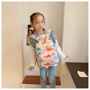 Pink cartoon dinosaur backpack for toddlers showing wide cushioned shoulder straps