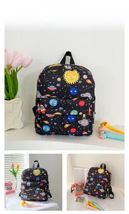 Detail view of black kids backpack with space galaxy patterns and metal double zippers