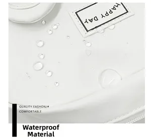 Close-up of white waterproof canvas fabric with water droplets and Happy Day label
