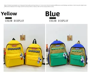 Detail view of children's canvas backpack in solid yellow and color-block patchwork designs