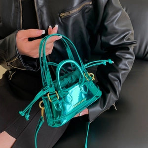 Glossy metallic green mini shell bag with gold hardware and fashion lettering design