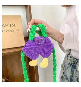 Handmade crochet mini bag in purple overalls design with cute feet and green strap