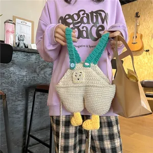 Handmade crochet crossbody bag in animal overall design with a pearl chain strap