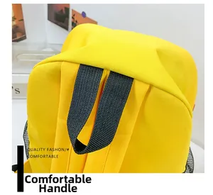 Detail showing reinforced black woven handle and durable yellow canvas fabric on kids backpack