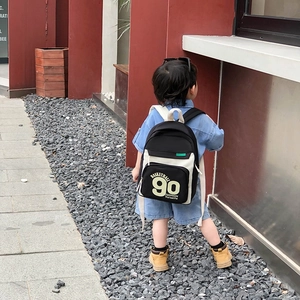 Sac à dos enfant en toile avec imprimé sport 90 et design contrasté noir et blanc