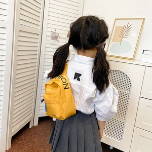 Kids trendy yellow canvas chest bag with fashion letter print and adjustable strap