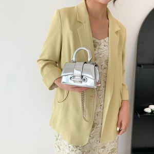 Mini shiny silver handbag with metallic mirror finish and stylish metal ball chain strap