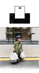 Outdoor scene of a boy wearing a lightweight color-block canvas backpack for kindergarten