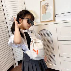 Kids fashion white canvas crossbody chest bag with orange lettering and shoulder strap