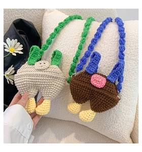 Detail of handmade crochet mini bags in funny overall shapes with woven shoulder straps