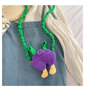 Handmade crochet kids crossbody bag with purple body and green textured woven strap