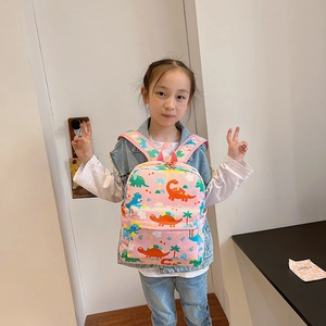 Pink cartoon dinosaur backpack for kids with front pocket and side water bottle holder