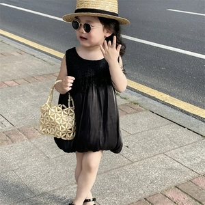 Elegant girls' black sleeveless dress with tweed texture and satin bubble skirt style