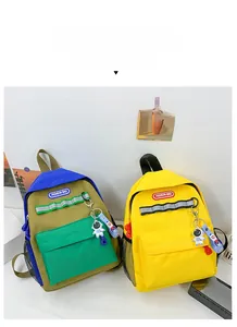 Detailed view of kids canvas backpack with safety reflective strips and astronaut charm