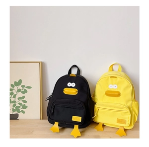 Detail of cartoon duck backpacks in yellow and black colors with 3D feet and side pockets