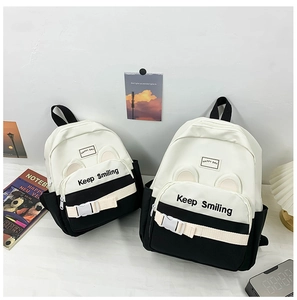 Detail of kindergarten backpacks in two sizes with Keep Smiling print and ear decor