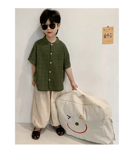 Détail du grand sac de rangement pour enfants en toile avec motif smiley coloré