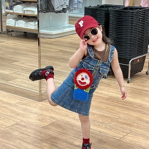 Kids handmade crochet clown crossbody bag with blue denim dress and red baseball cap