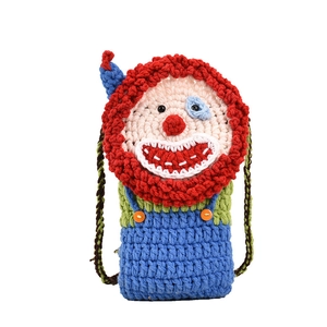 Handmade crochet clown crossbody bag for children with colorful knit yarn and strap