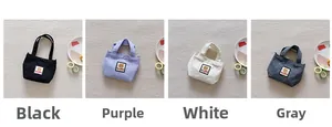 Detail view of small canvas handbags in four colors with cute bear patch and HAPPY text