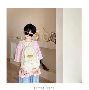 Detailed view of kids cute canvas duck backpack with wide straps and funny duck feet