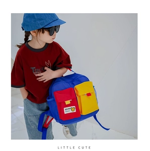 Detailed view of the colorful canvas kids backpack with multi-pocket contrast design