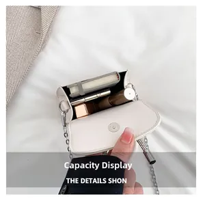 Capacity display of white leather crossbody bag with chain showing cosmetics storage