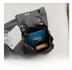 Interior view showing black quilted backpack capacity for tablet, phone and wallet